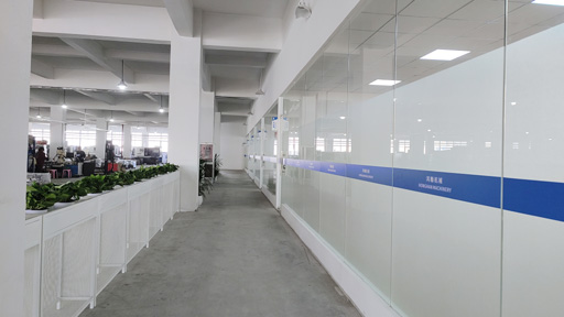 Modern manufacturing facility interior, industrial equipment, clean factory floor, professional industrial photography